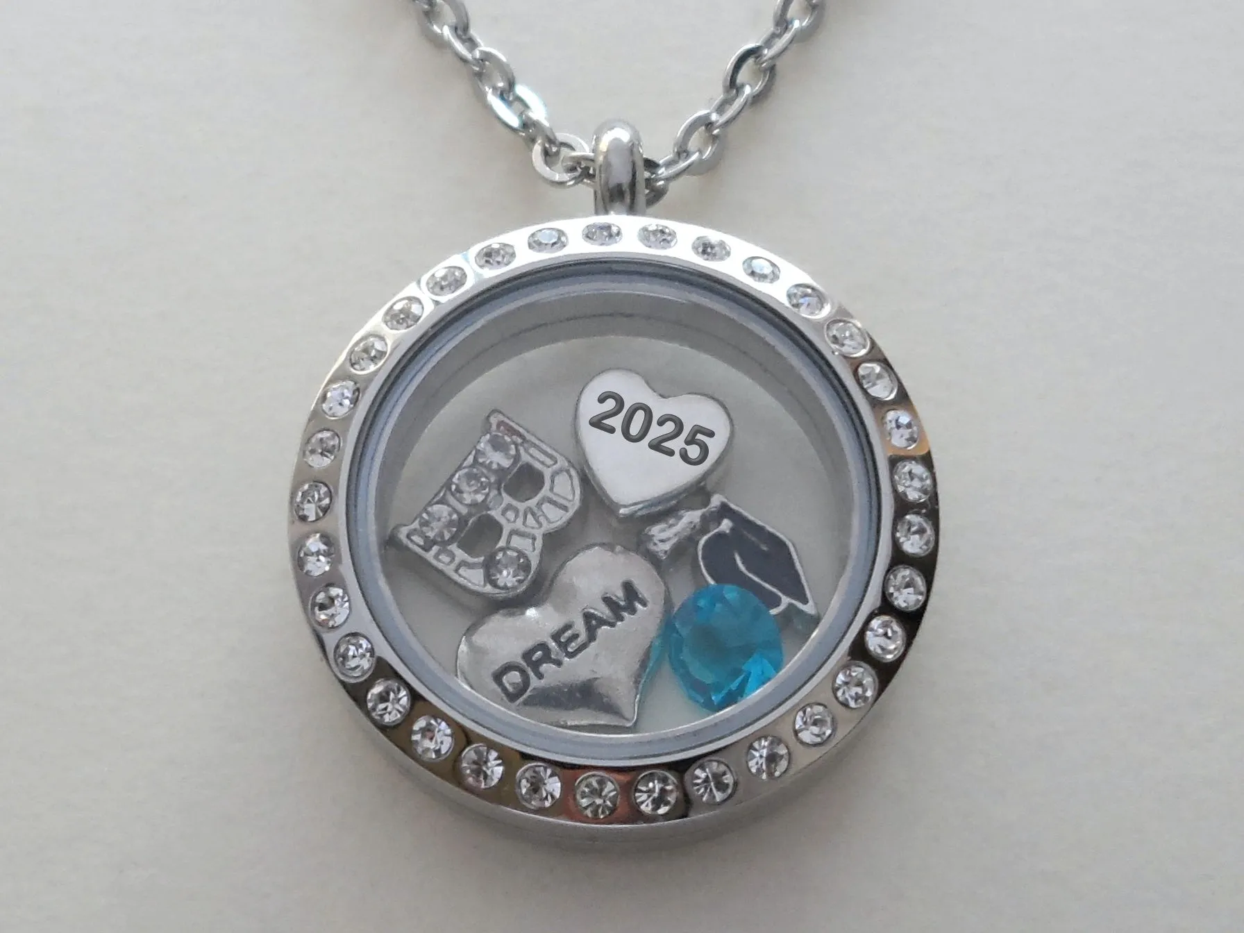 Class of 2025 Graduate Locket Necklace with Graduate Cap, 2025 Heart Charm, and Custom Letter & Birthstone - by Jewelry Everyday