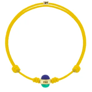 PAX Cabochon Bead on Yellow Cord Bracelet